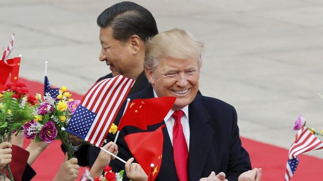 Trump backs off China tariff plan with delays for cellphones, laptops