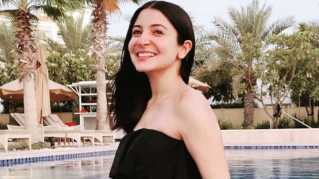 Anushka Sharma is all smiles as she flaunts her baby bump in a swimming pool