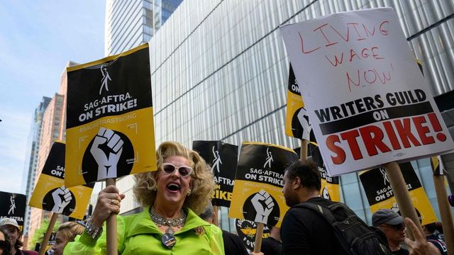 Striking Hollywood writers reach tentative deal with studios