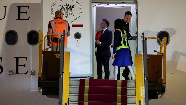 French President Macron plays down apparent shove from wife in Vietnam
