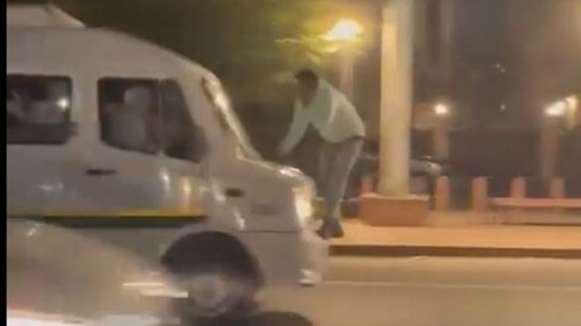 Watch | Man dragged atop moving minibus in Delhi