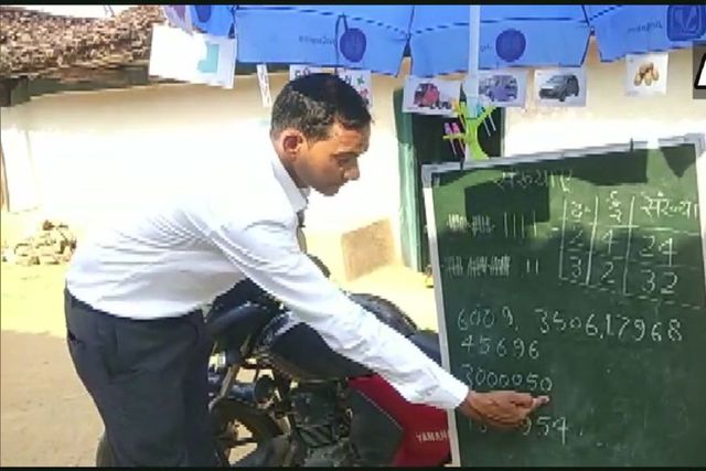 Blackboard Strapped To Bike, Teacher Brings School To Students