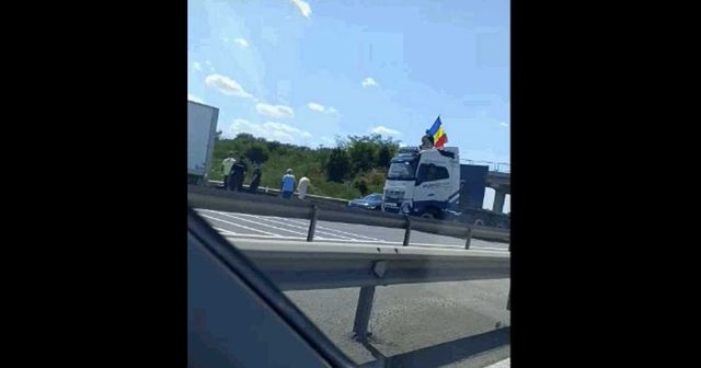 Intrarea în București, blocată de un șofer care flutură steagul României