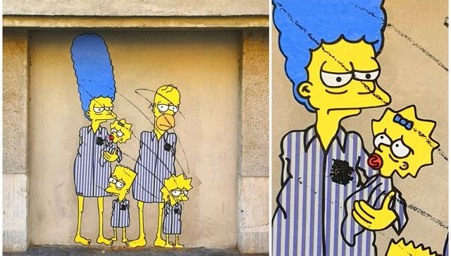 Shoah, vandalizzato il murale dei Simpson in versione deportati al Memoriale: le stelle di David coperte con spray nero
