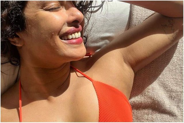Priyanka Soaks Sun in Orange Bikini, Gets Cozy With Nick in Pics From New Year Celebration