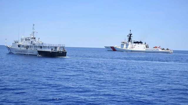 China warns US after American warship sails near disputed territory in South China Sea