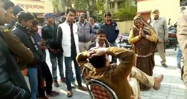Uttar Pradesh police suspended after video of woman falling at his feet goes viral