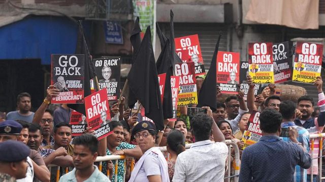 Protesters wave black flags at CEC Gyanesh Kumar during his visit to Kalighat temple in Kolkata