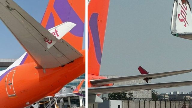 Wing of SpiceJet plane clips parked Akasa jet