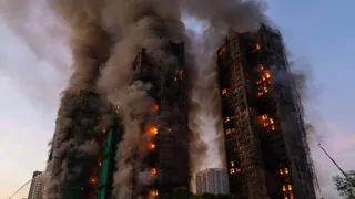 4 killed, dozens trapped after fire engulfs multiple high-rises in Hong Kong