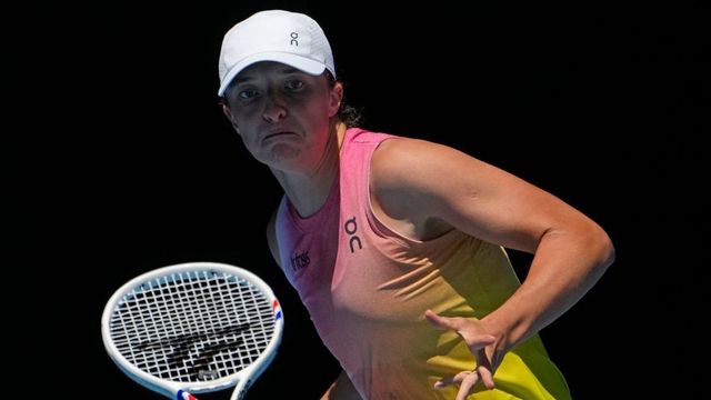 Iga Swiatek moves in a 3rd-round match against Raducanu at the Australian Open