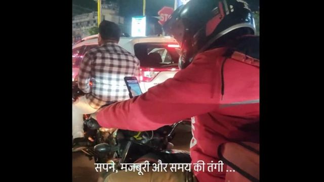 Viral video of Zomato delivery agent studying for UPSC exam amid traffic motivates internet, watch