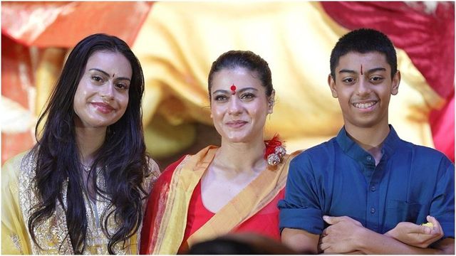 Kajol celebrates Durga Puja with children Nysa and Yug in traditional finery